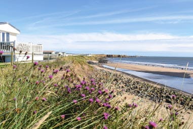 a group of caravans overlooking Whitley Bay beach