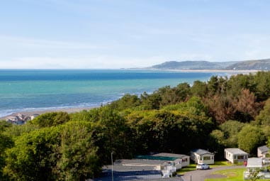 lush woodland overlooking azure seas