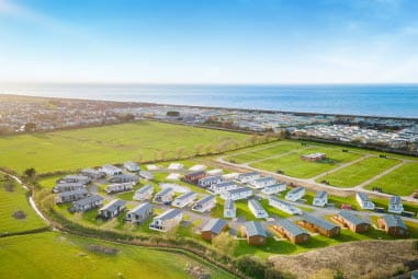 aerial shot of Ty Mawr holiday park with caravans and proximity to the sea