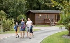 family walking through a holiday park