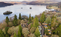 An aerial view over Fallbarrow Holiday Park and Lake Windermere in the Lake District 
