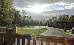 Looking out at the park's woodland surroundings from a lodge veranda at Tummel Valley Holiday Park