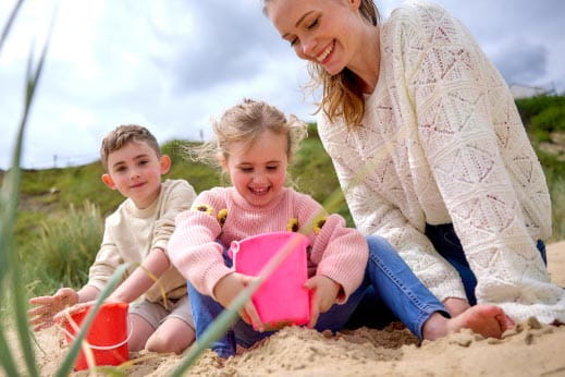 Family building sandcastle