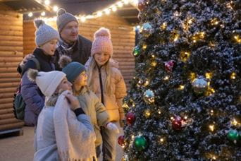 Family looking at Christmas tree