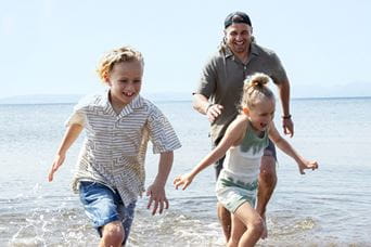 Kids running on beach