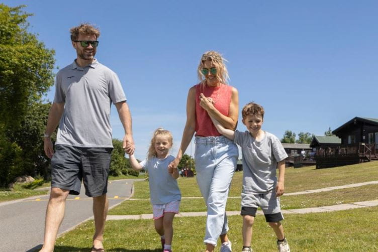 Family walking in the sunshine
