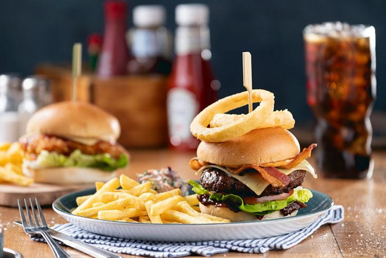 Burgers and drinks on a table in a Parkdean Resorts restaurant
