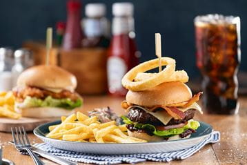 Burgers and drinks on a table in a Parkdean Resorts restaurant