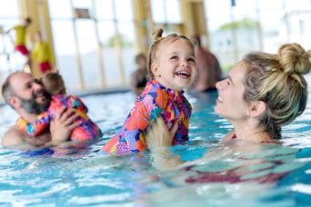 Family in the swimming pool at parkdean resorts