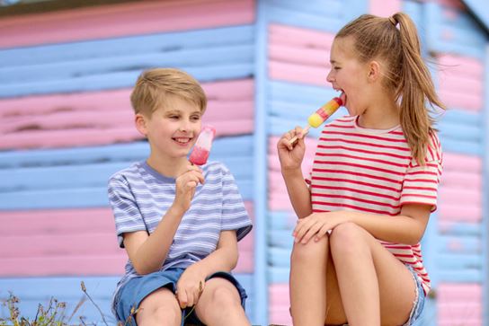 Little boy and girl eating ice cream