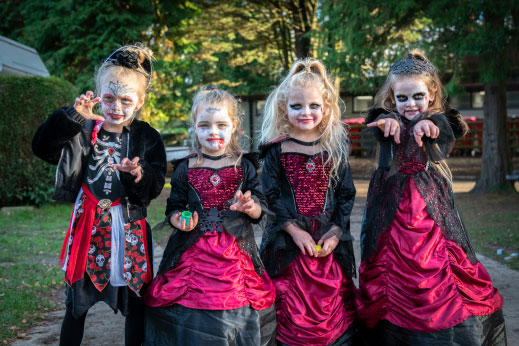Little girls dressed up as scary witches for Halloween