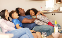 A family laughing together in a caravan