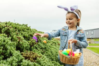 Little girl finding Easter eggs