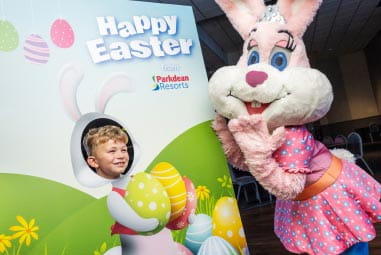 Easter bunny taking a selfie with a child