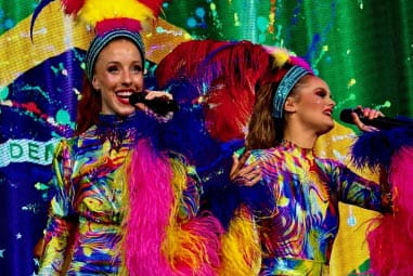 Carnival girls singing on stage
