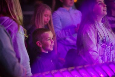 Kids looking up at stage