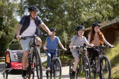 Family on a bike ride at Parkdean Resorts