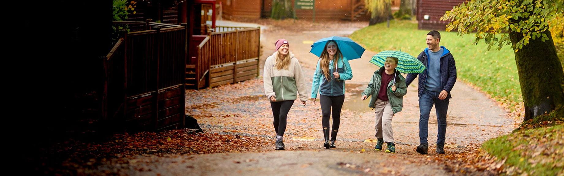 Family walking by lodges