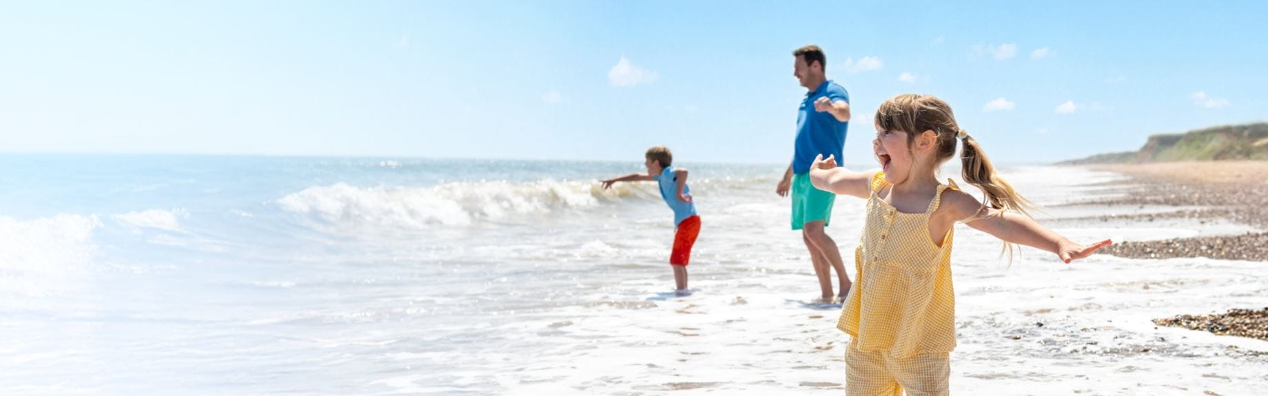 Family playing on the beach