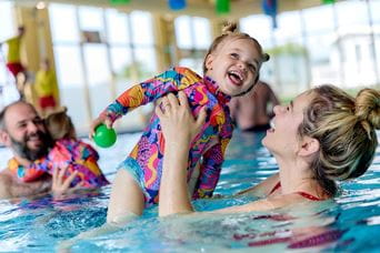 Mum and daughter playing in the indoor pool