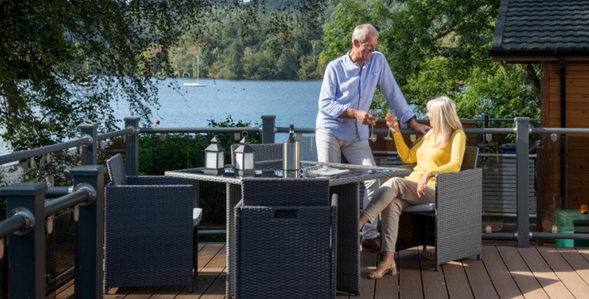 Older couple on veranda with drinks