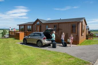 Family in front of lodge