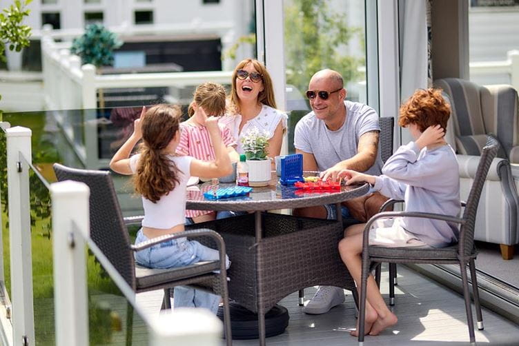 Family on lodge decking