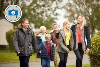 A family exploring a holiday park to browse caravans for sale