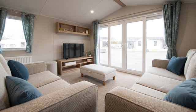 The living area and patio doors of the Willerby Malton caravan