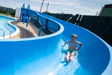 a child riding a water slide