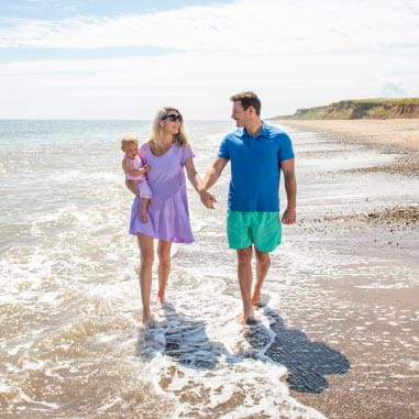 a couple walking on a beach