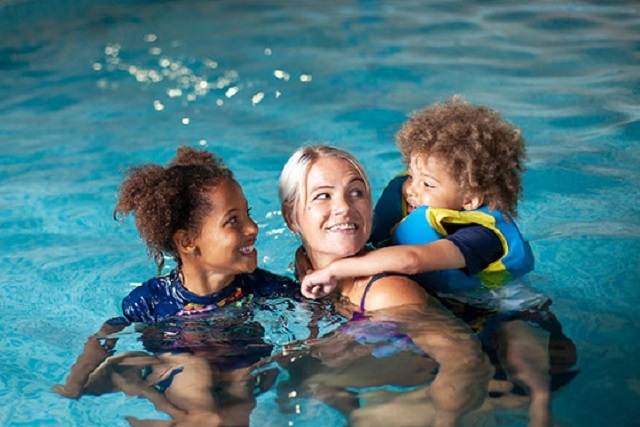 mother and two children in the pool