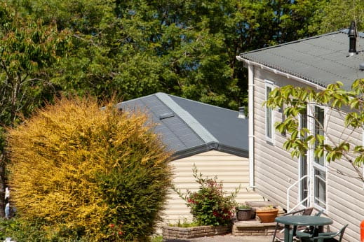 Park Dean caravan accommodation set amongst greenery and flowers