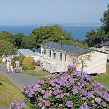 A Park Dean caravan set on a green hill