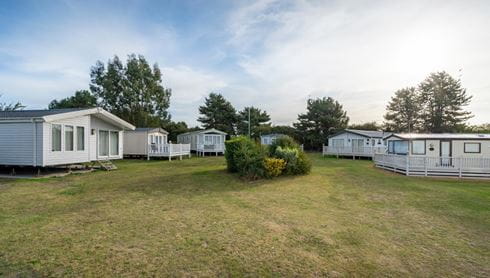 Caravans sitting in a green field