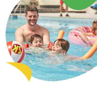 A family playing in the swimming pool at Breydon Water Holiday Park