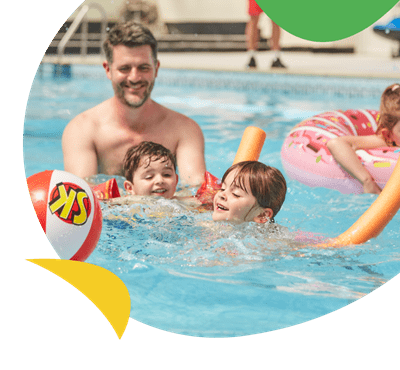 A family playing in the swimming pool at Breydon Water Holiday Park
