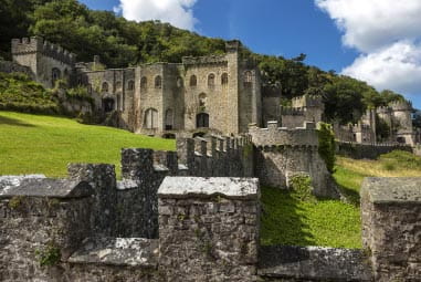 Stony wall leading to a castle on a hill