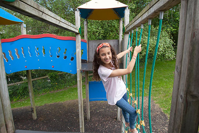 A girl enjoying the adventure playground