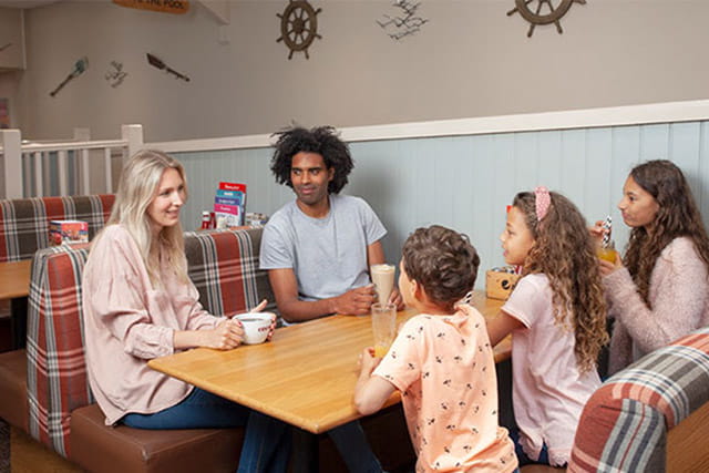 A family enjoying drinks in the cafe
