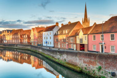 Colourful row of houses by a canal