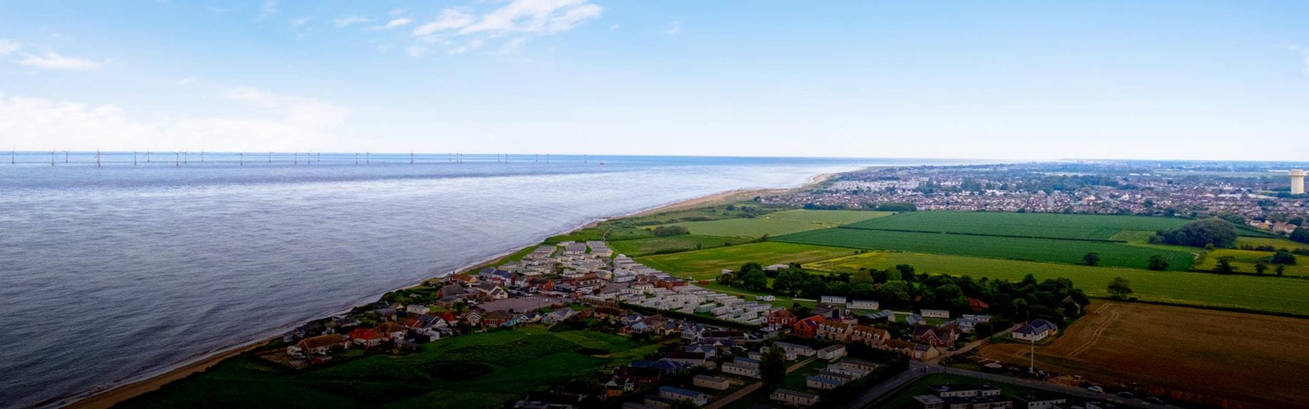 Wide view of California Cliffs, town, countryside and coast
