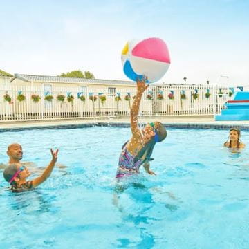 Kids playing in an outdoor pool