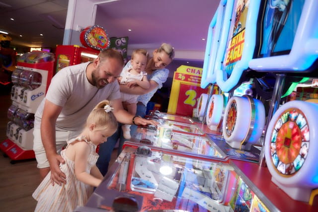 Family at amusement arcade