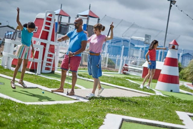 family playing crazy golf