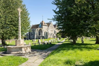 Church and cemetery courtyard with trees