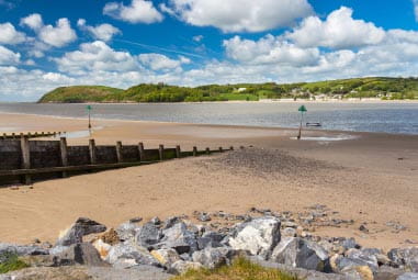 a sandy beach with blue skies