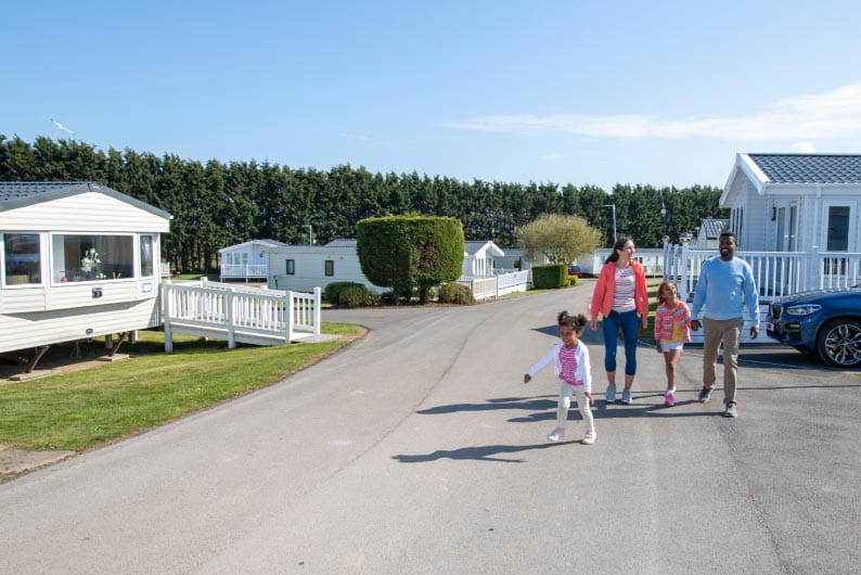 a family walking through the park