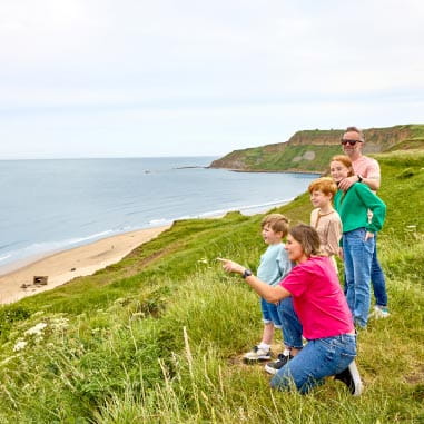 a family enjoying a coastal walk