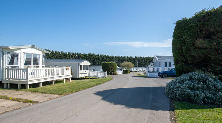 Sun shining over the caravans at Cayton Bay